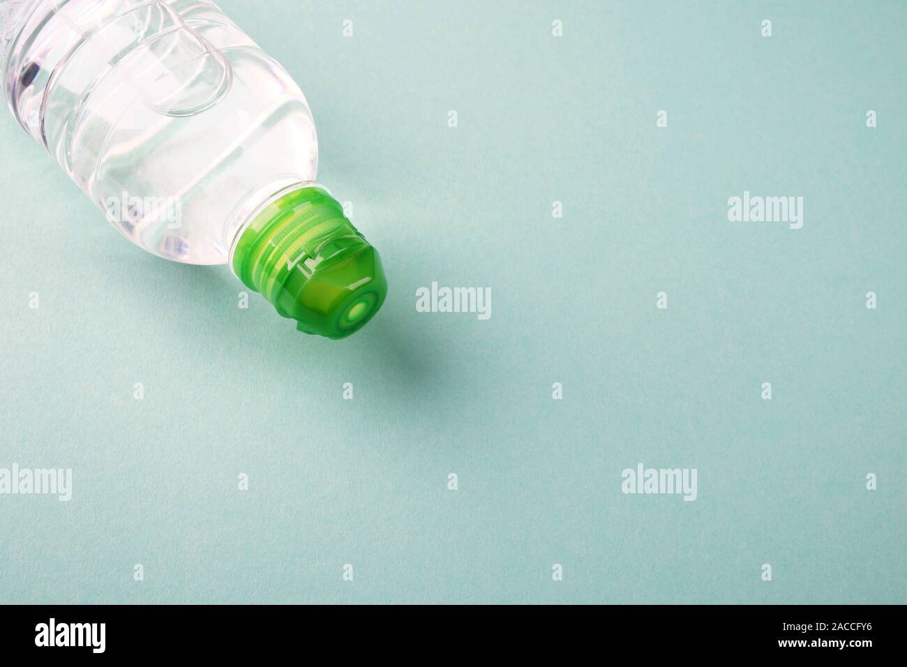 Download Bottle Of Clear Water On A Light Turquoise With Place For Text Stock Photo Alamy PSD Mockup Templates