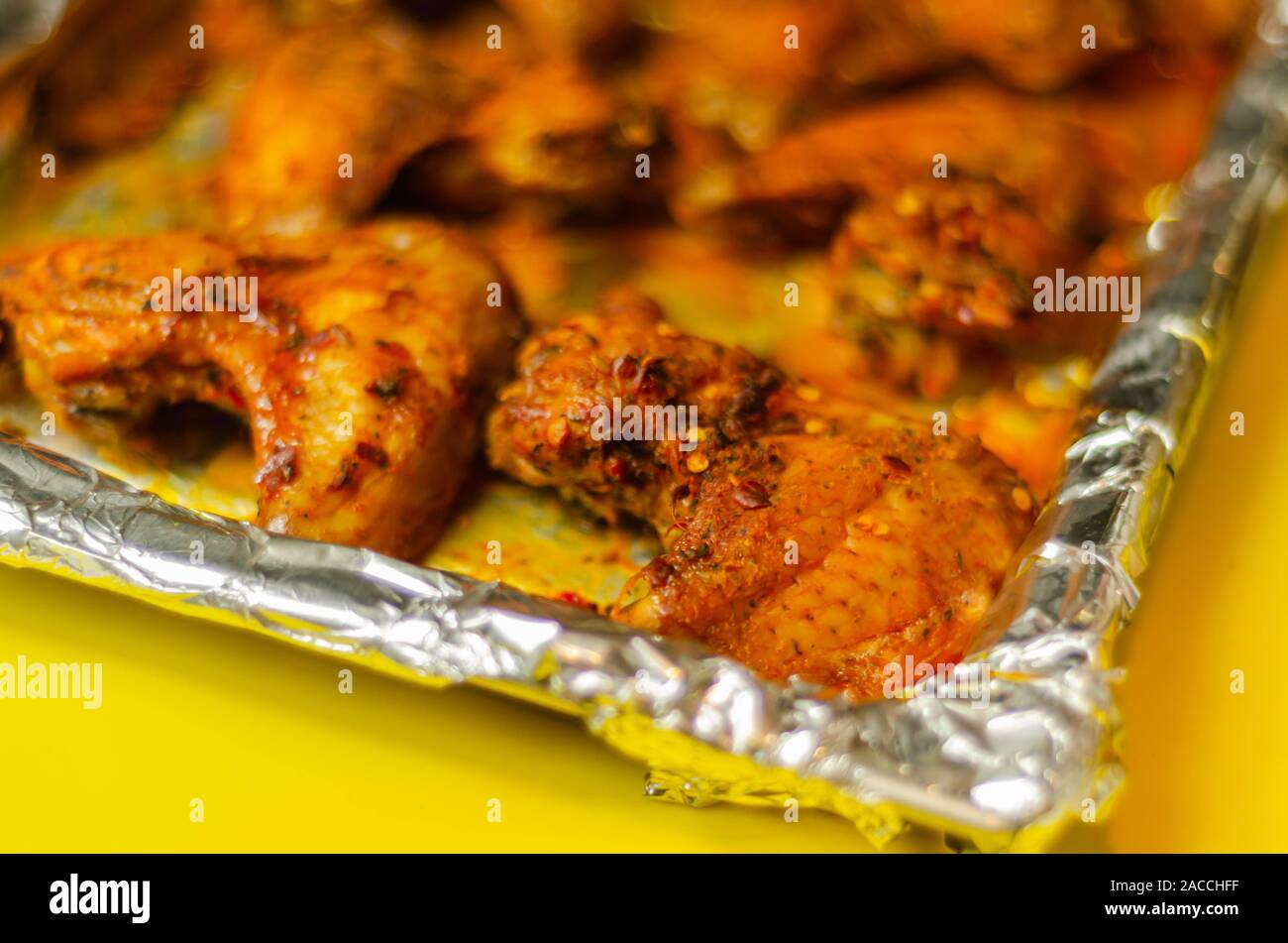 Roasted chicken wings marinated in a spicy periperi sauce, a delicious