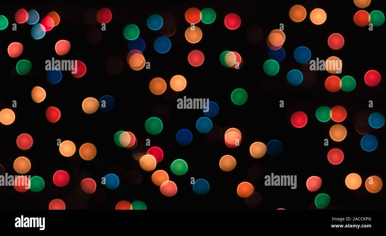 multicolored circles on a black background with blur abstract pattern Stock Photo