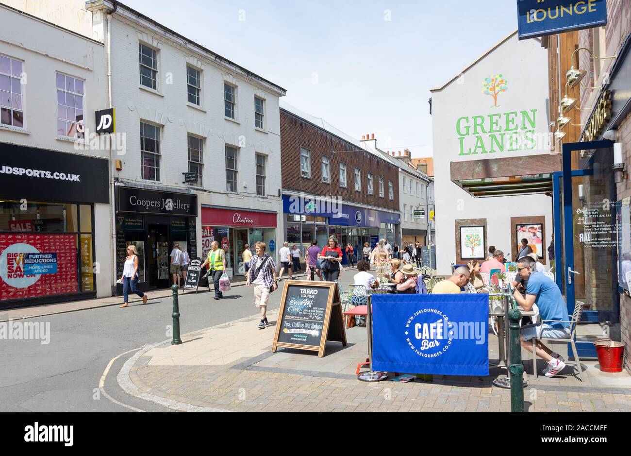 Outdoor street cafe flowers pedestrianised high street shops sho hires