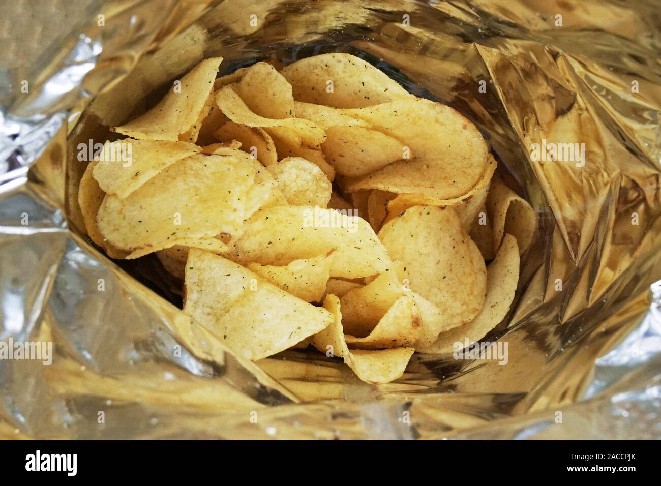 close-up look inside a bag of potato chips or packet of crisps, cheese and onion flavor Stock Photo