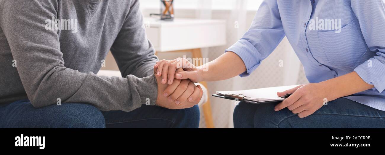 Psychotherapist supporting her depressed patient close up Stock Photo