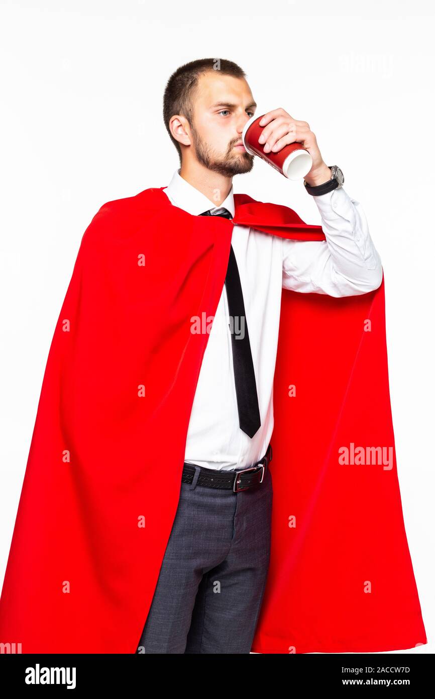 Businessman dressed like superhero drinking coffee Stock Photo