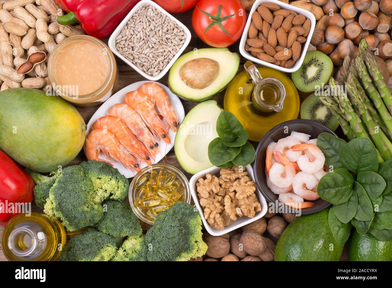 Vitamine E food sources, top view on wooden background Stock Photo