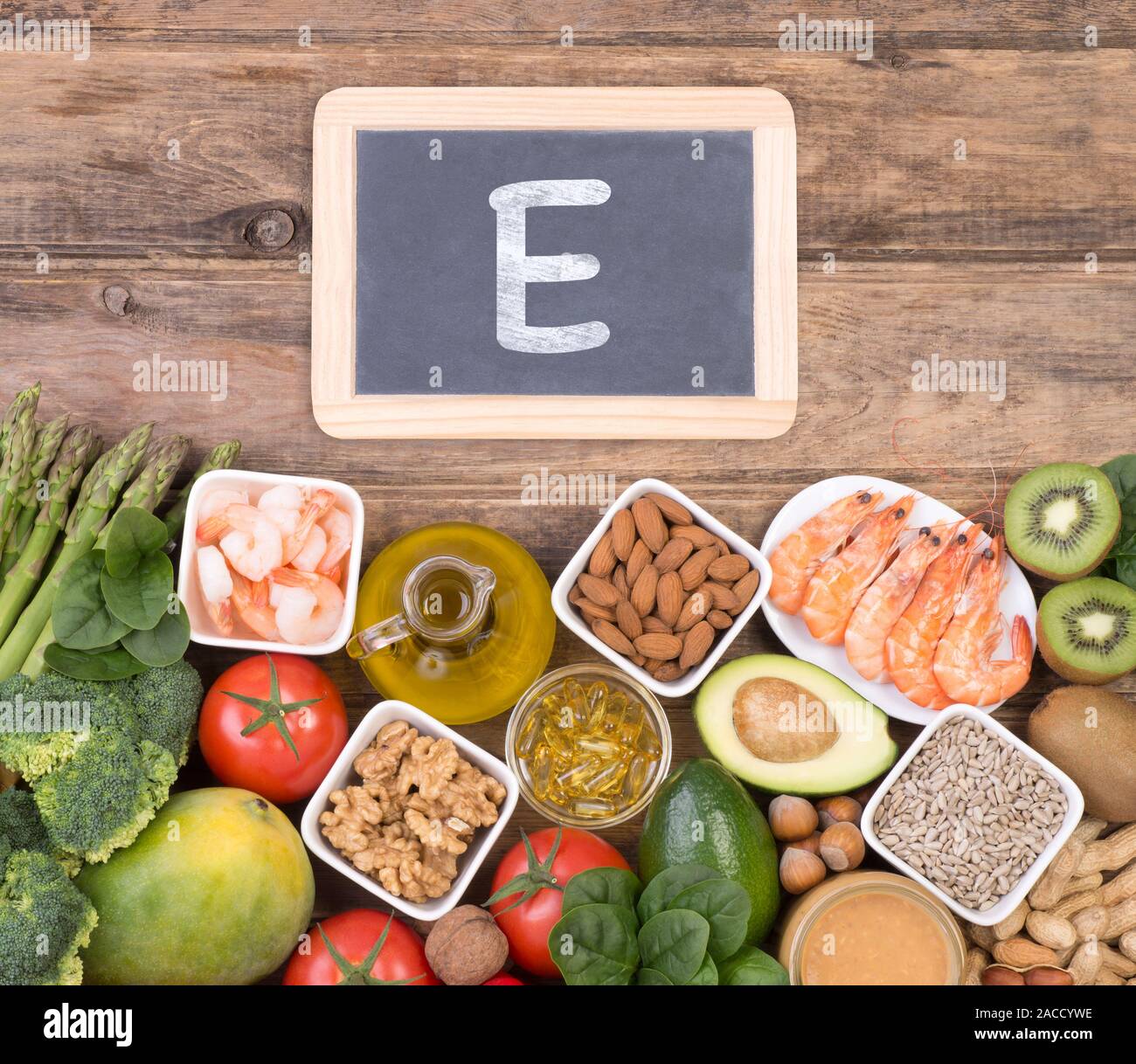 Vitamine E food sources, top view on wooden background Stock Photo