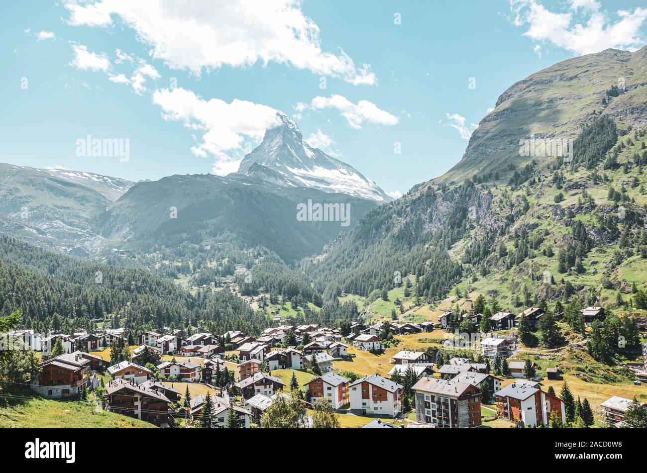 Picturesque Alpine village Zermatt in Switzerland in the summer season. Famous Matterhorn mountain in the background. Typical Alpine mountain huts. Swiss Alps, Alpine landscapes. Stock Photo