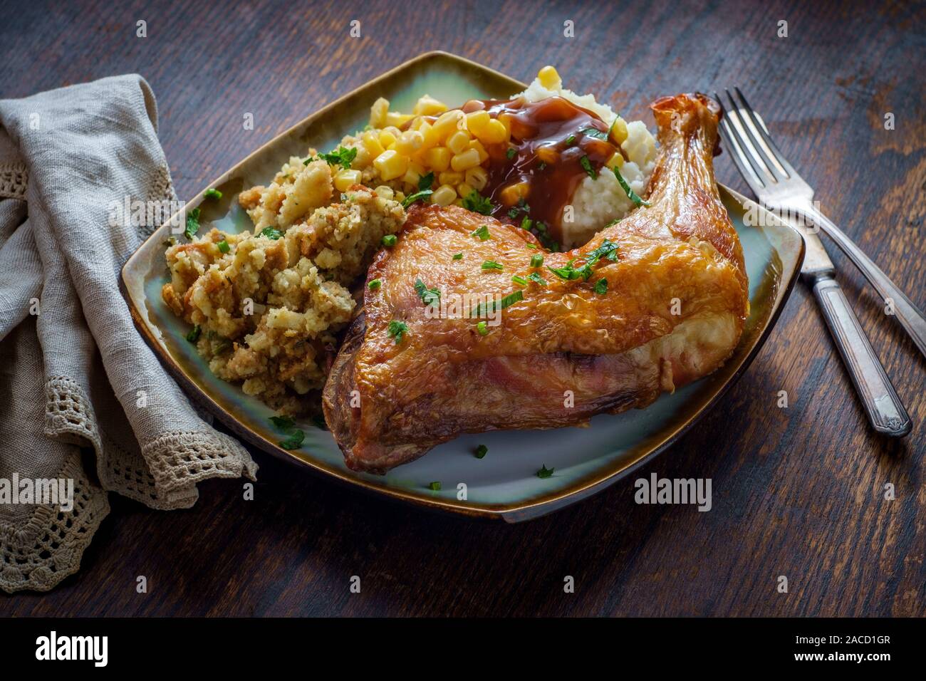 Traditional American Thanksgiving Dinner Plate With Crispy Baked Turkey Leg Mashed Potatoes Stuffing Gravy And Corn Stock Photo Alamy