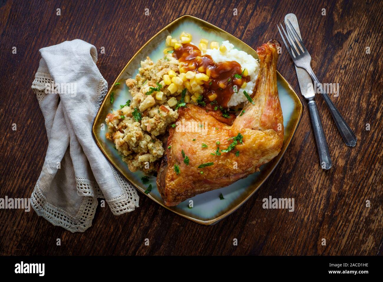 Traditional American Thanksgiving Dinner Plate With Crispy Baked Turkey Leg Mashed Potatoes Stuffing Gravy And Corn Stock Photo Alamy