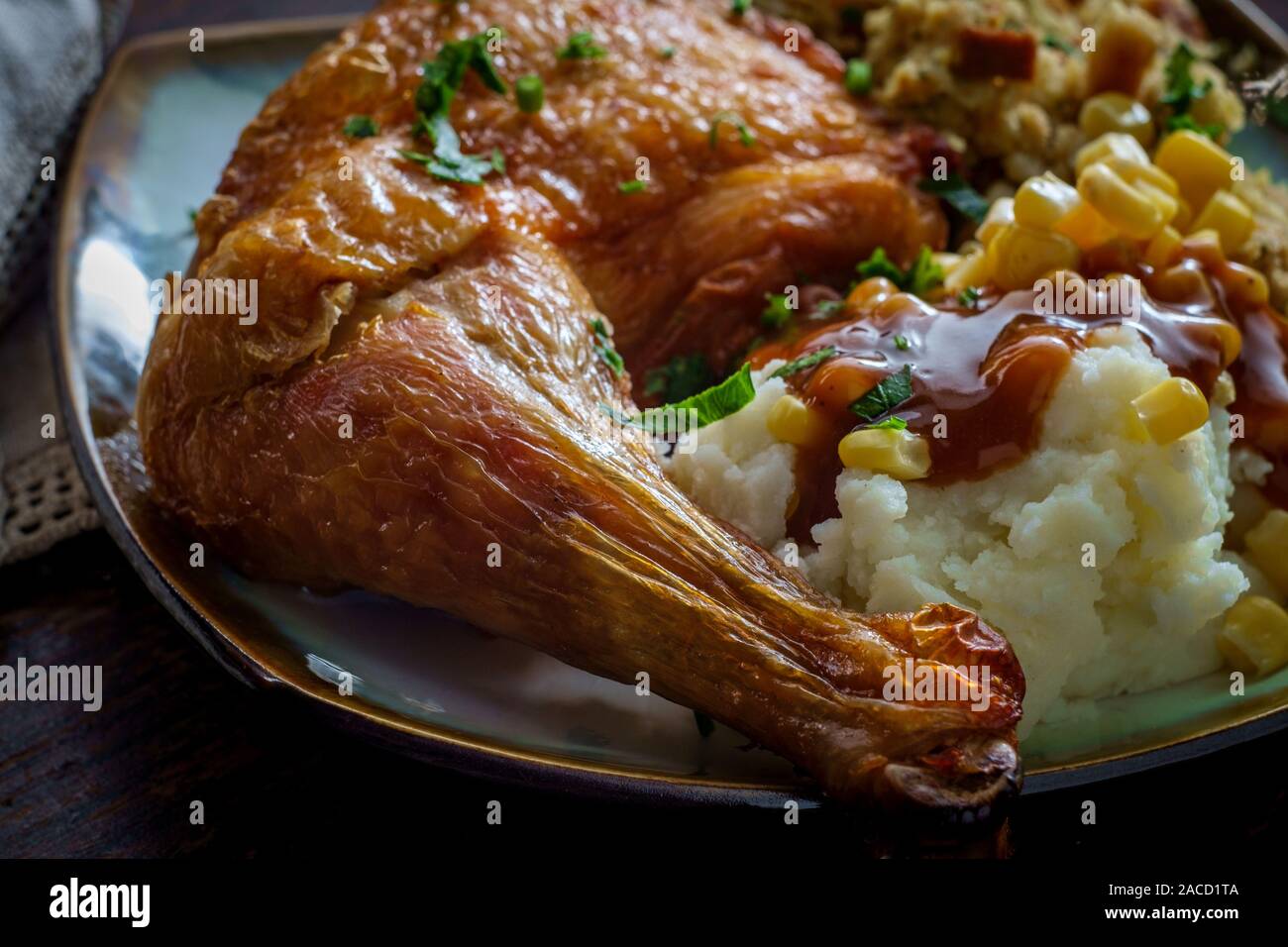 Traditional American Thanksgiving Dinner Plate With Crispy Baked Turkey Leg Mashed Potatoes Stuffing Gravy And Corn Stock Photo Alamy