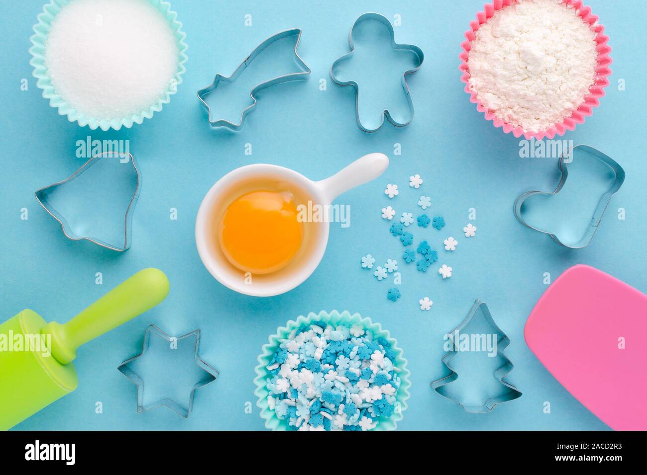 ingredients and cookie cutter on blue background, flat lay Stock Photo