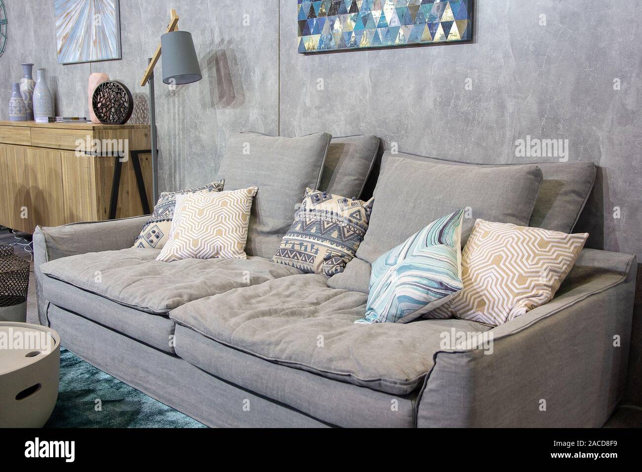 Gray minimalist room with sofa. Scandinavian interior design Stock Photo