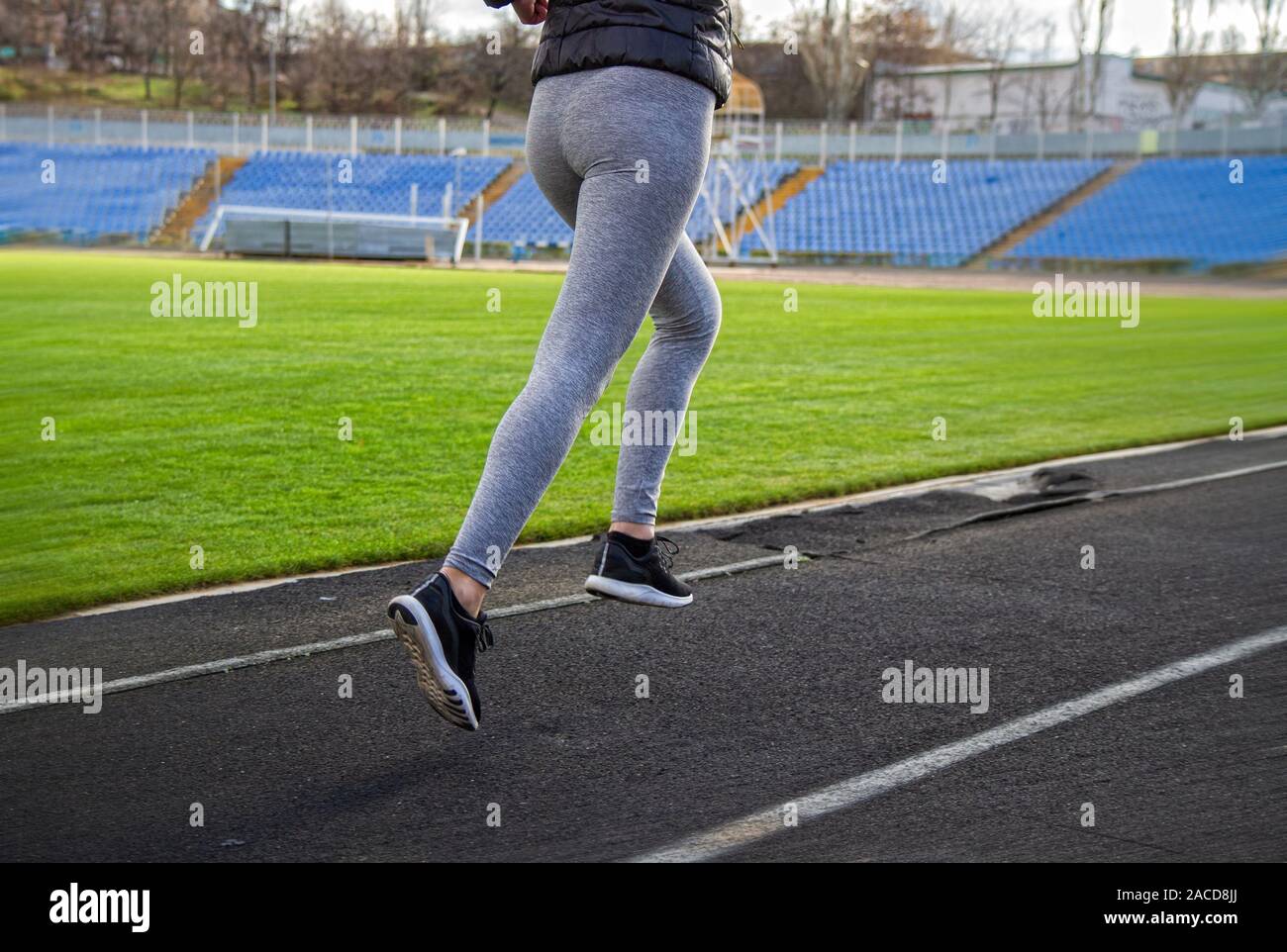 Girl is engaged in jogging Stock Photo Alamy