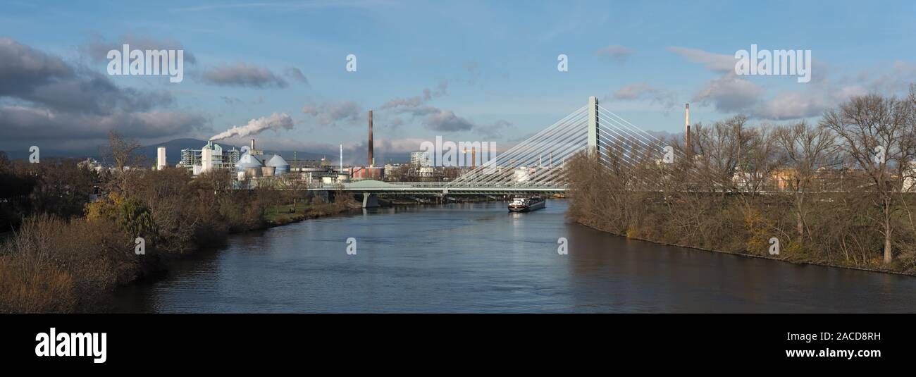 barge in front of industrial plants on the main river in frankfurt hoechst Stock Photo