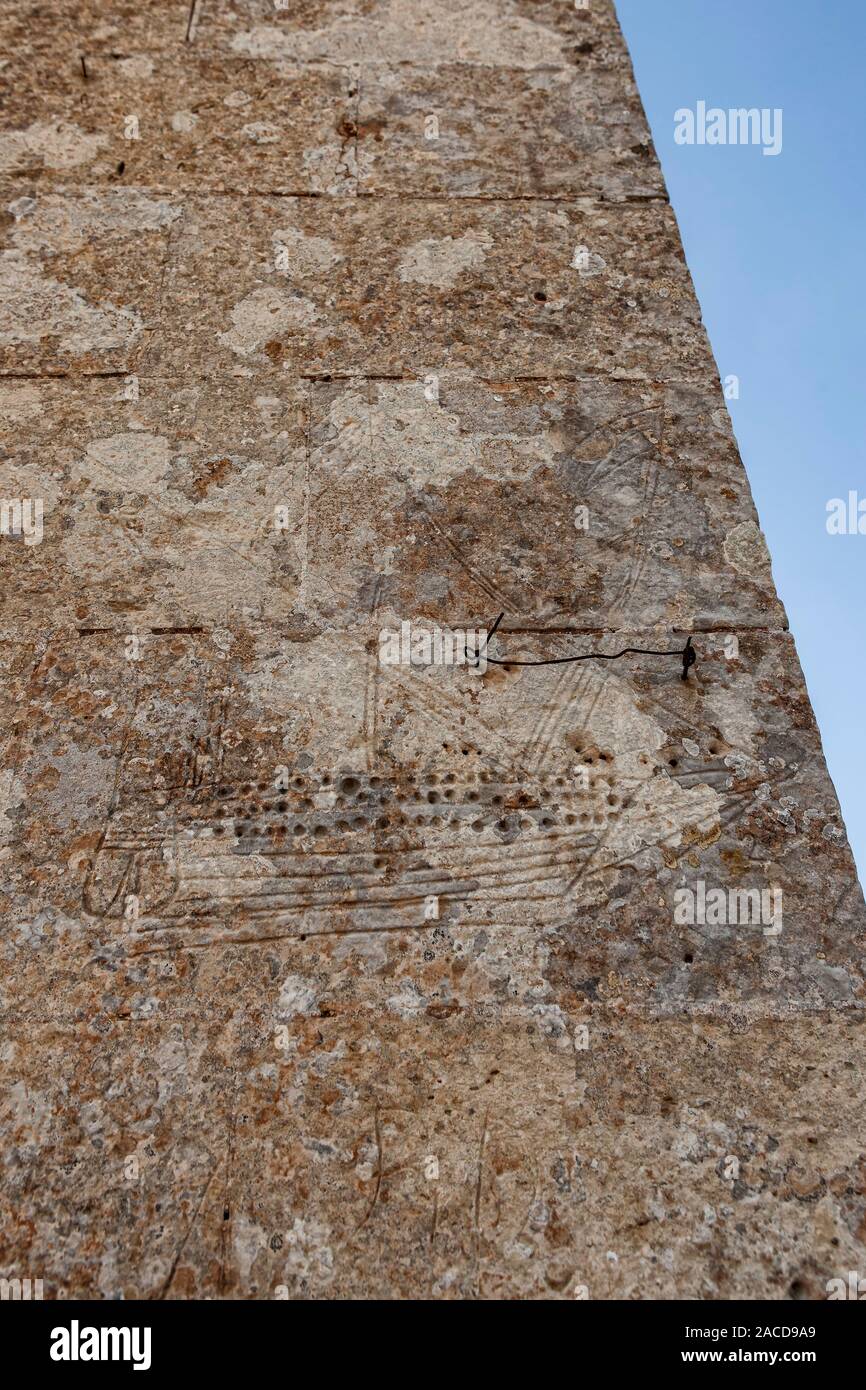 A very old graffiti of a galley of the Knights of Malta on one of the exterior walls at the Kuncizzjoni Chapel in Malta Stock Photo