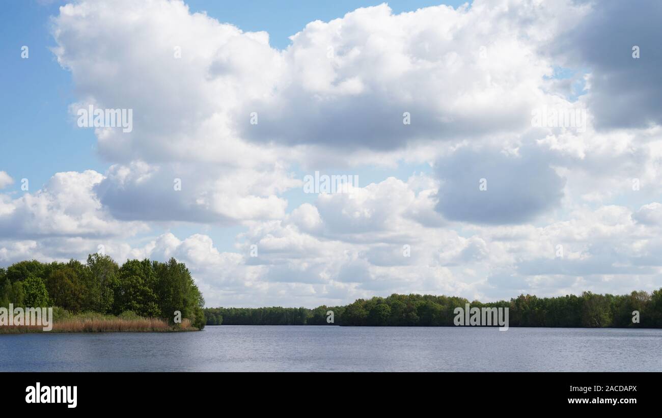 dramatic clouds over bathing lake in Germany Stock Photo