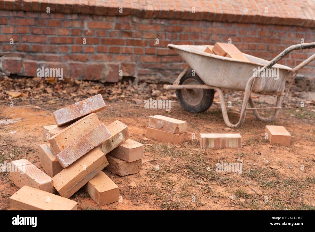 Close up picture of construction site. Bricks in a wheelbarrow Stock