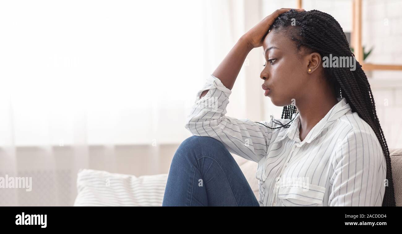 African woman sitting alone side view hi-res stock photography and ...