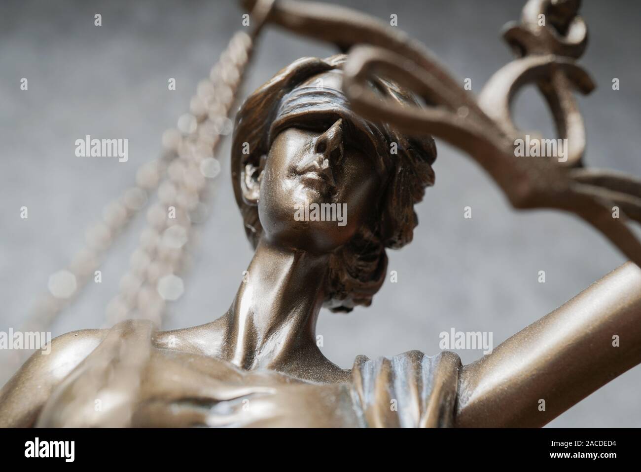 lady justice or iustitia - detail of blind or blindfolded bronze statue - law and legislation symbol Stock Photo
