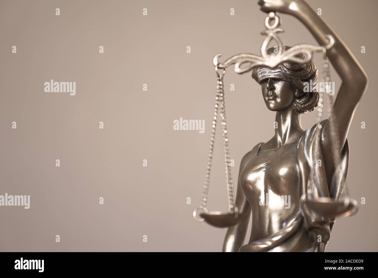 lady justice or justitia - detail of blind or blindfolded bronze statue holding balance scales - law jurisprudence and impartiality symbol - background with copy space Stock Photo