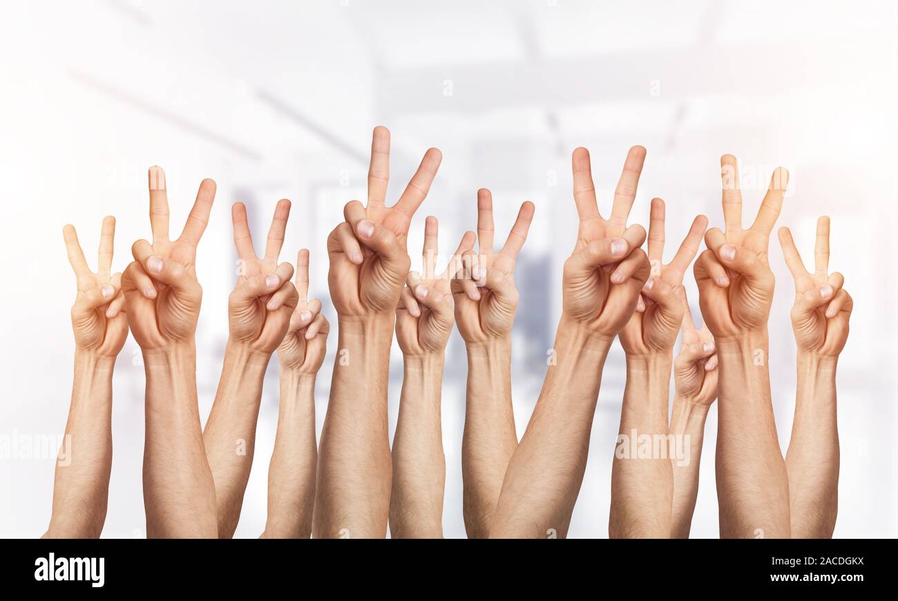 Man hands raised showing two hi-res stock photography and images - Alamy