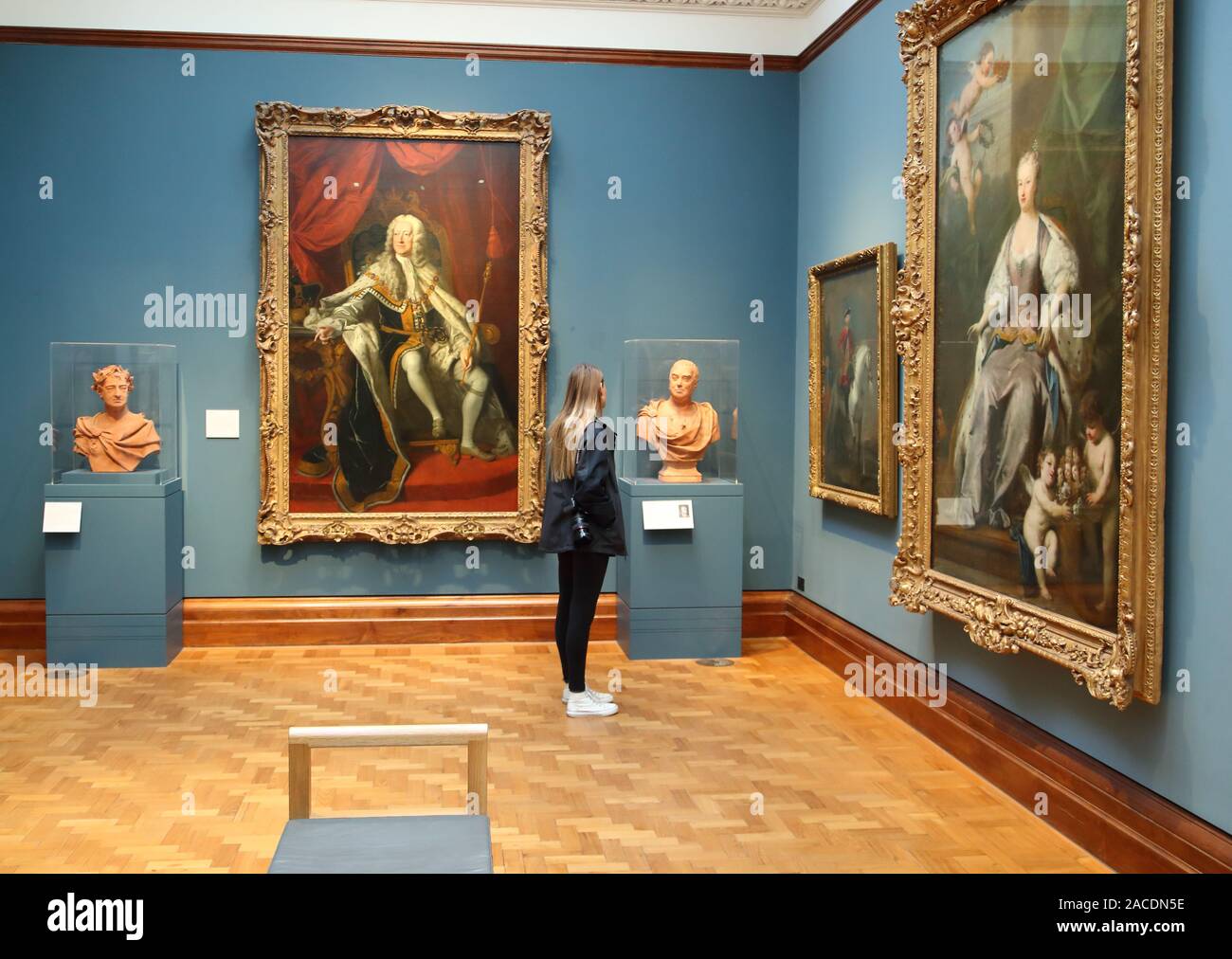 A woman studies 18th century paintings at the National Portrait Gallery, London, UK Stock Photo