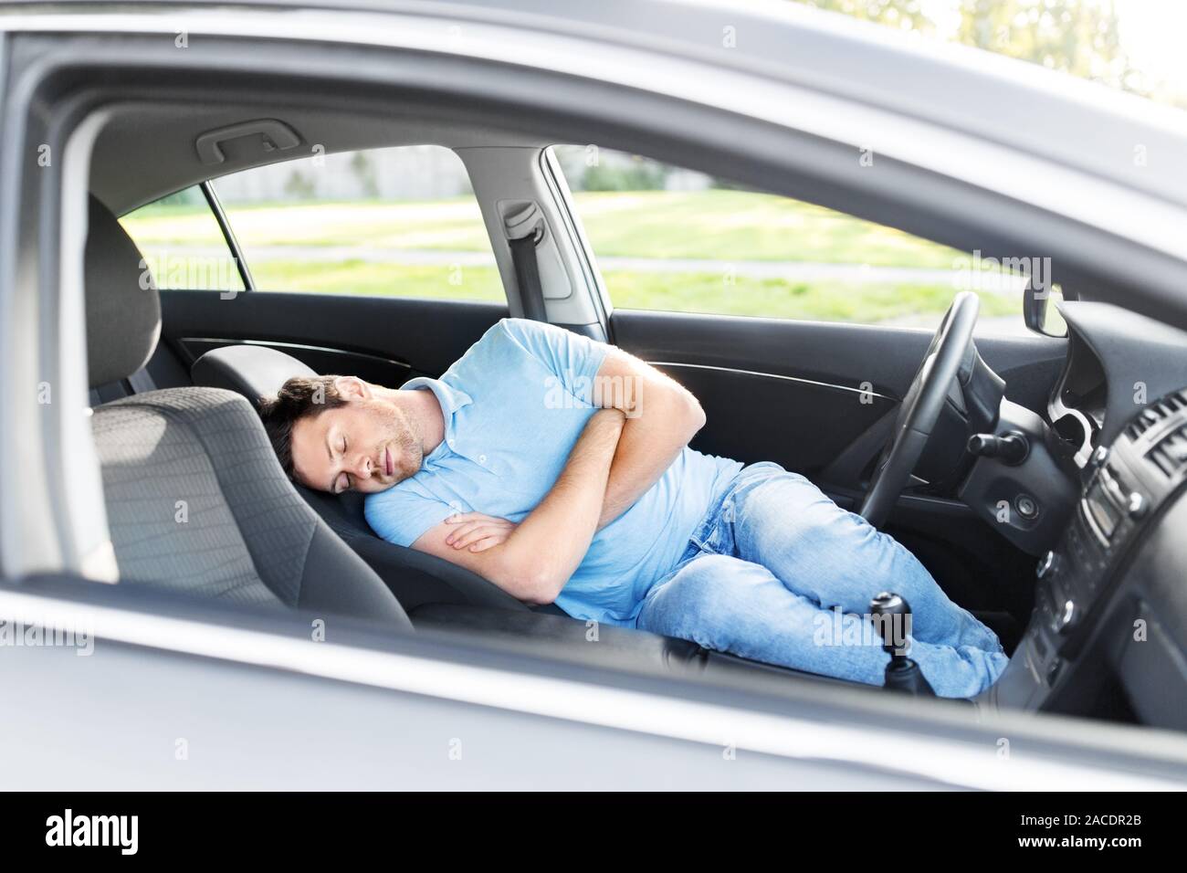 https://c8.alamy.com/comp/2ACDR2B/tired-man-or-driver-sleeping-in-car-2ACDR2B.jpg