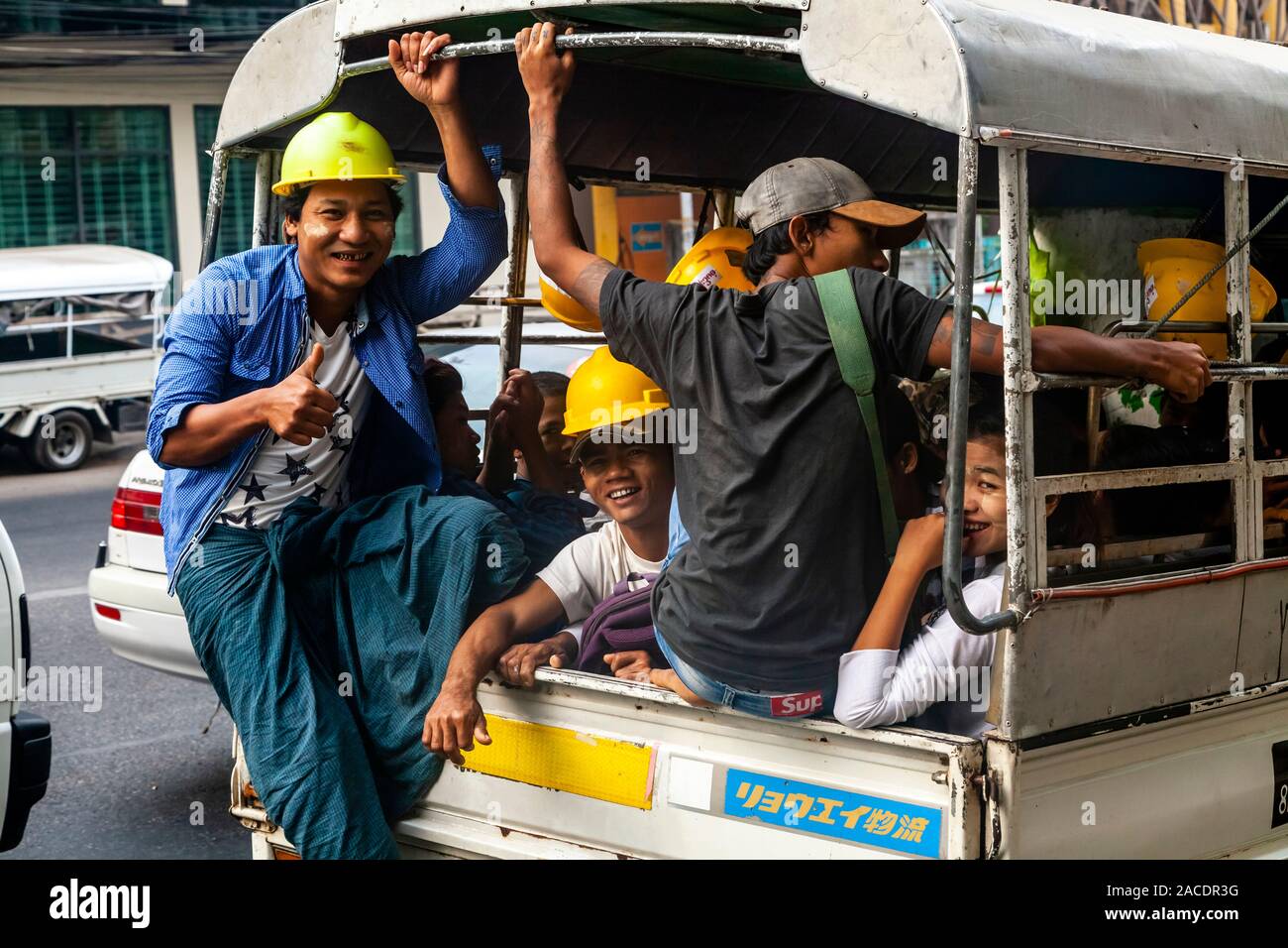 Smiling Burmese Construction Workers In A Pick Up Truck, Yangon, Myanmar. Stock Photo