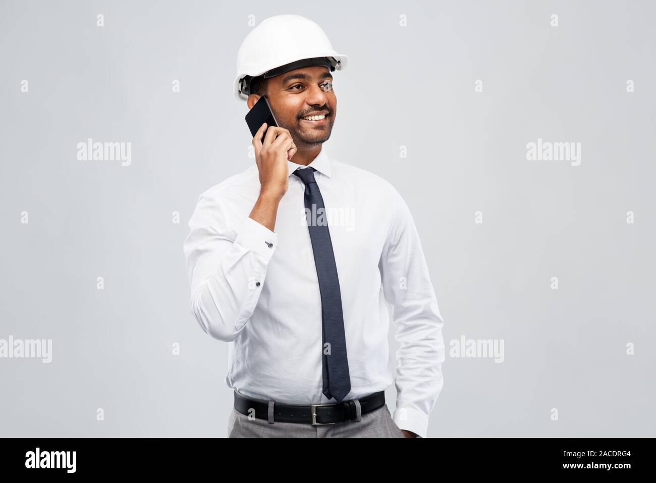 indian male architect calling on smartphone Stock Photo