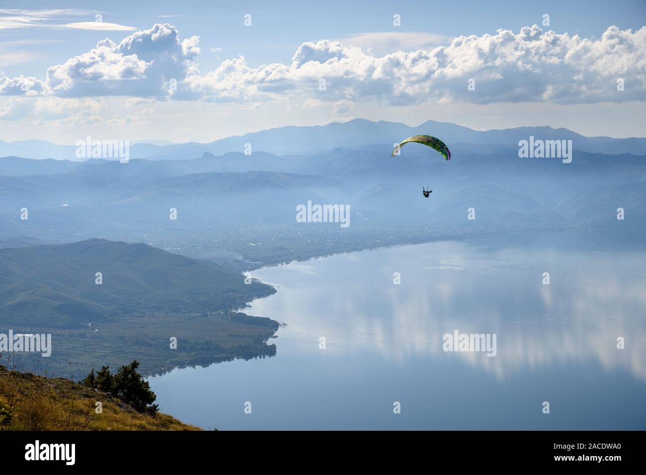Paragliders in the Galičica National Park above Lake Ohrid in North Macedonia, with Albania in the distance, North Macedonia, Europe. Stock Photo