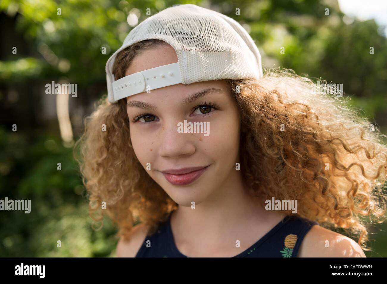 Girl wearing baseball cap Stock Photo