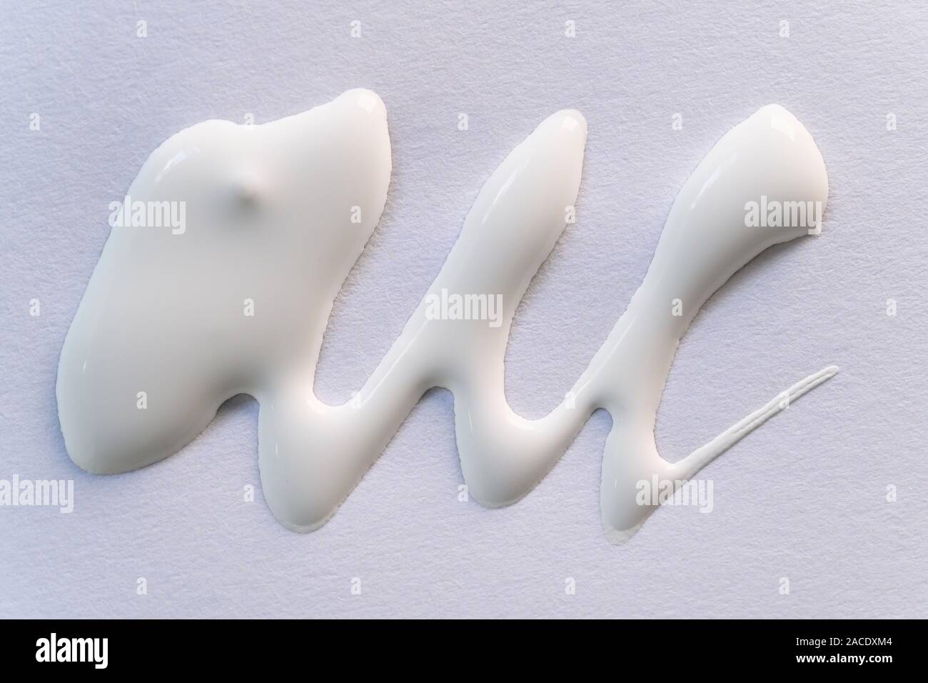 White paint on paper Stock Photo Alamy
