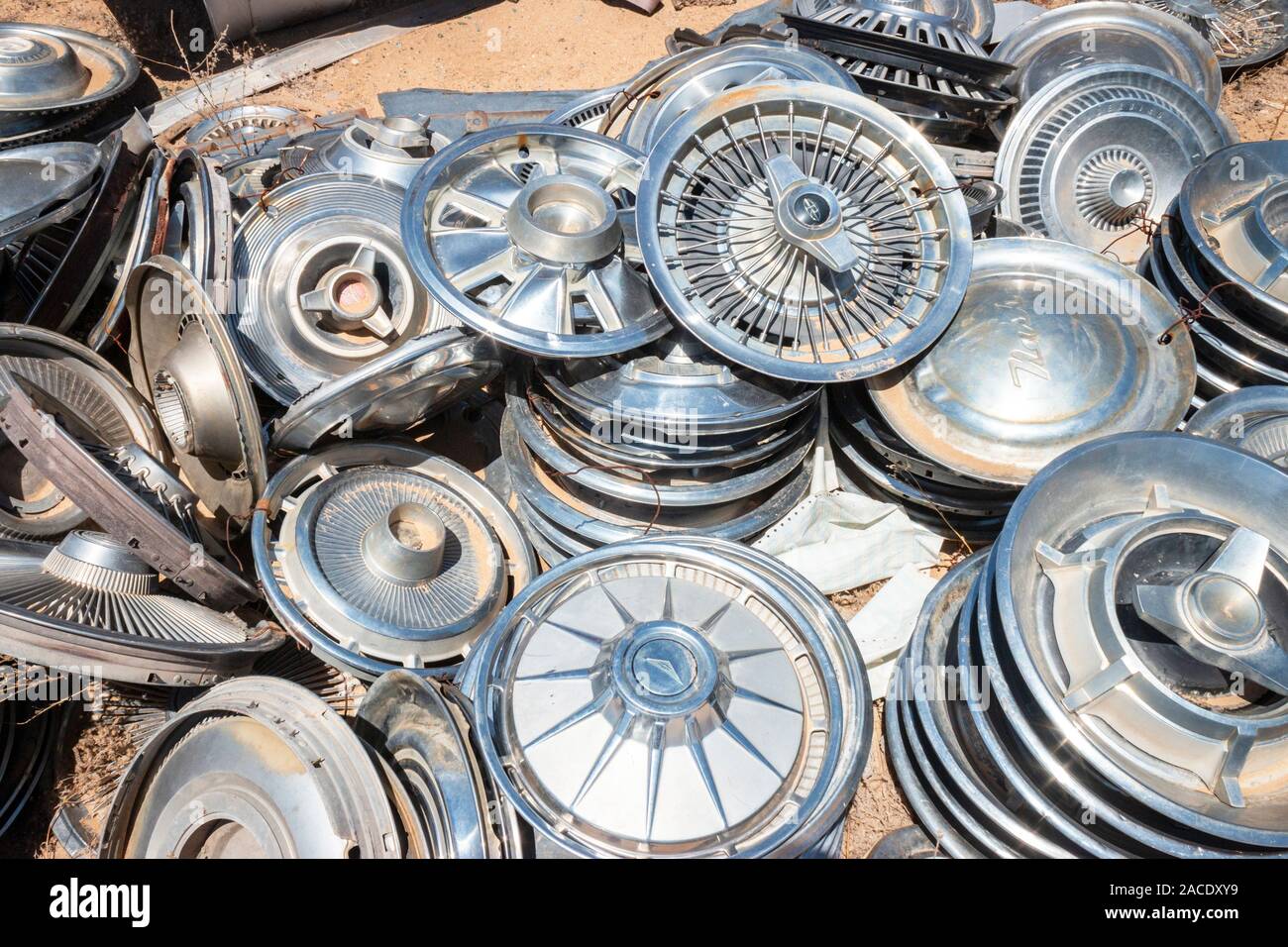shiny chrome wheel hub caps in a junk yard in the desert near Phoenix  Arizona USA Stock Photo - Alamy