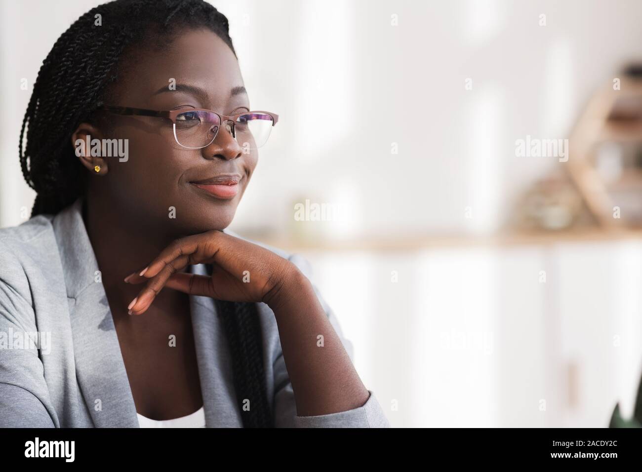 Closeup portrait of confident african american businesswoman in glasses Stock Photo