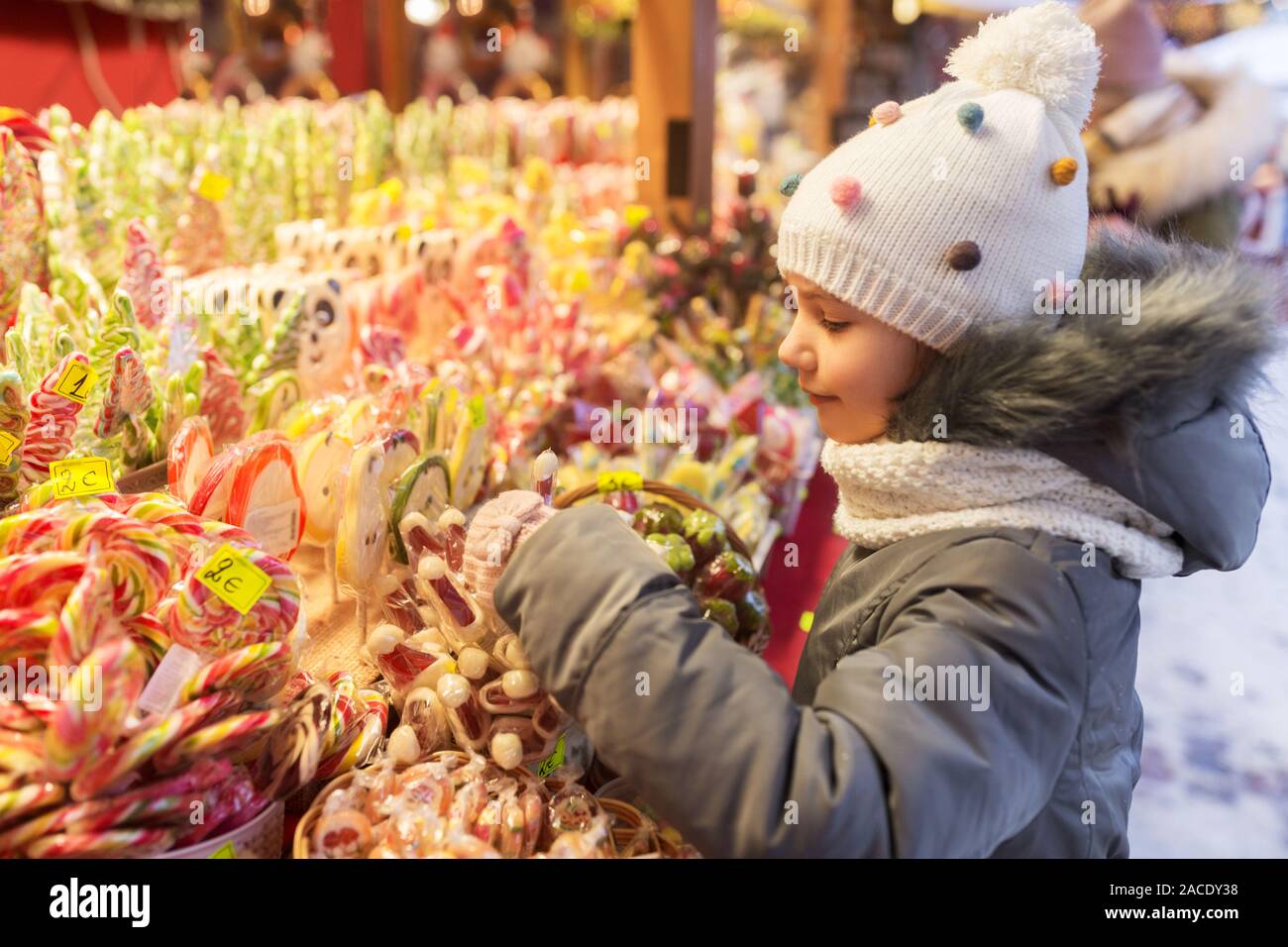 Sweets Choose little girl choosing sweets at christmas market Stock Photo - Alamy