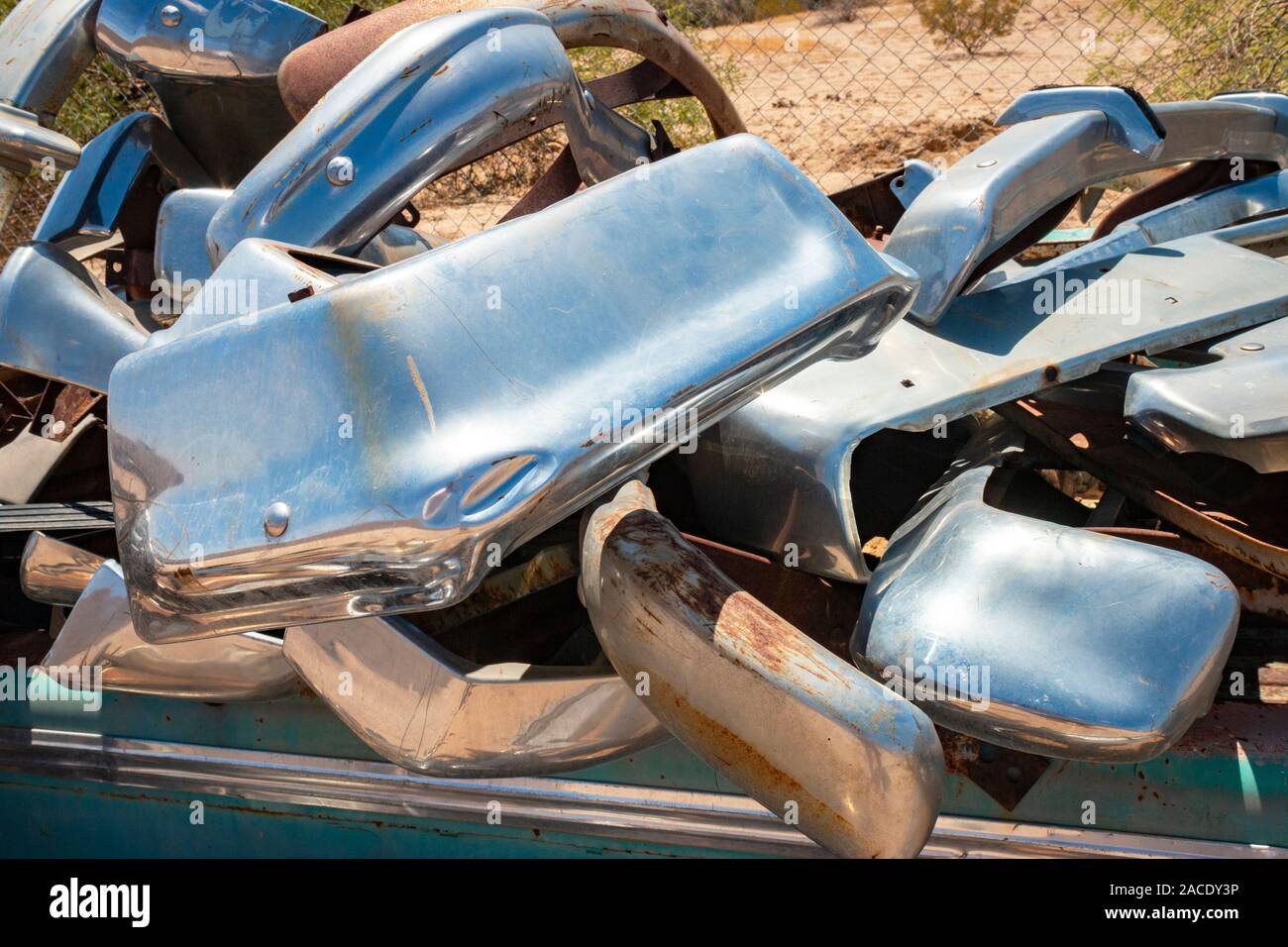 chrome fenders bumpers in a junk yard in the desert near Phoenix