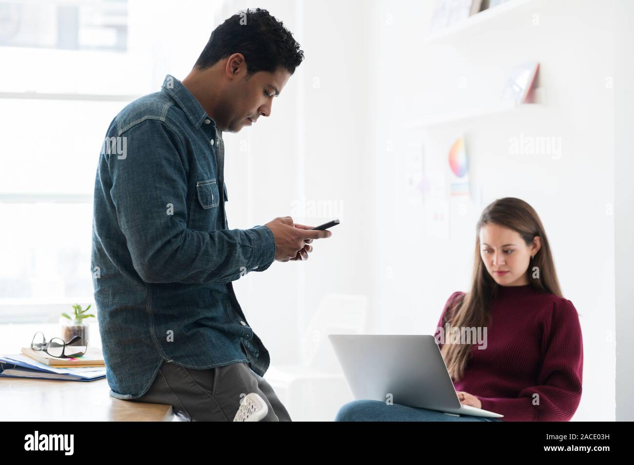 Colleagues working together in office Stock Photo