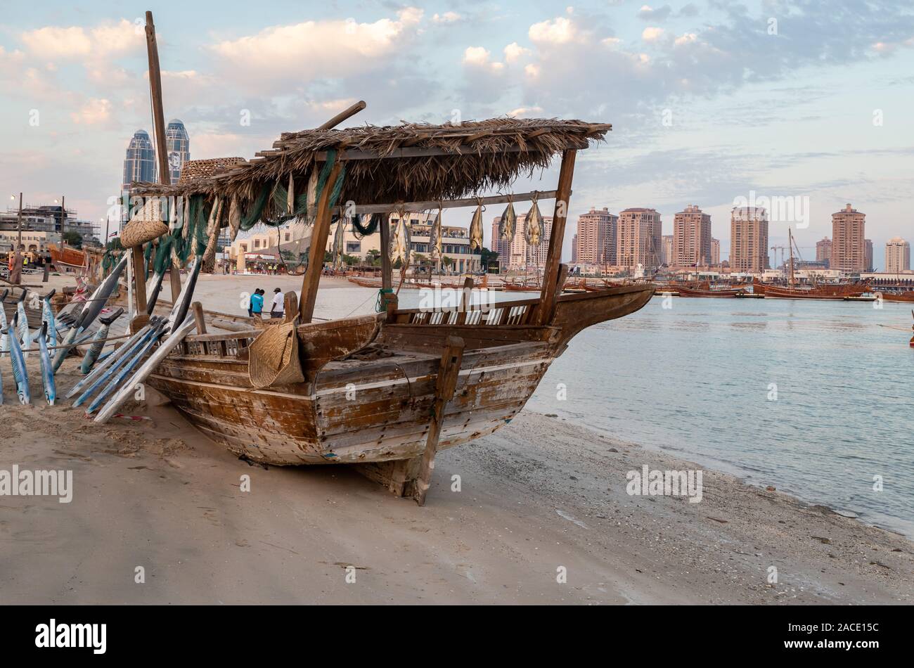 Traditional Dhow Festival in Katara cultural village, Doha, Qatar showing old decorated wooden Arabic boats with clouds in the sky in background Stock Photo