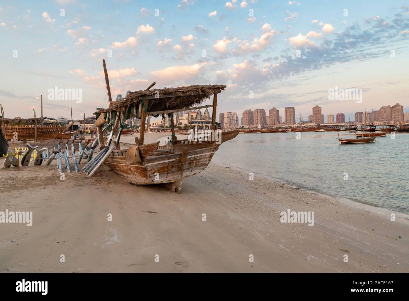 Traditional Dhow Festival in Katara cultural village, Doha, Qatar showing old decorated wooden Arabic boats with clouds in the sky in background Stock Photo