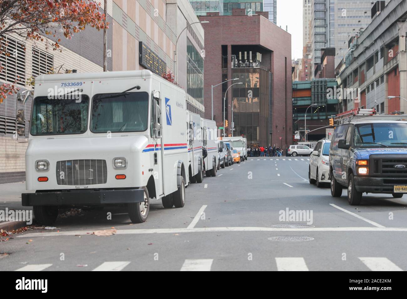 New York November 28 2019: USPS Post Office Mail Trucks in New York. The Post Office is Responsible for Providing Mail Delivery IV - Image Stock Photo