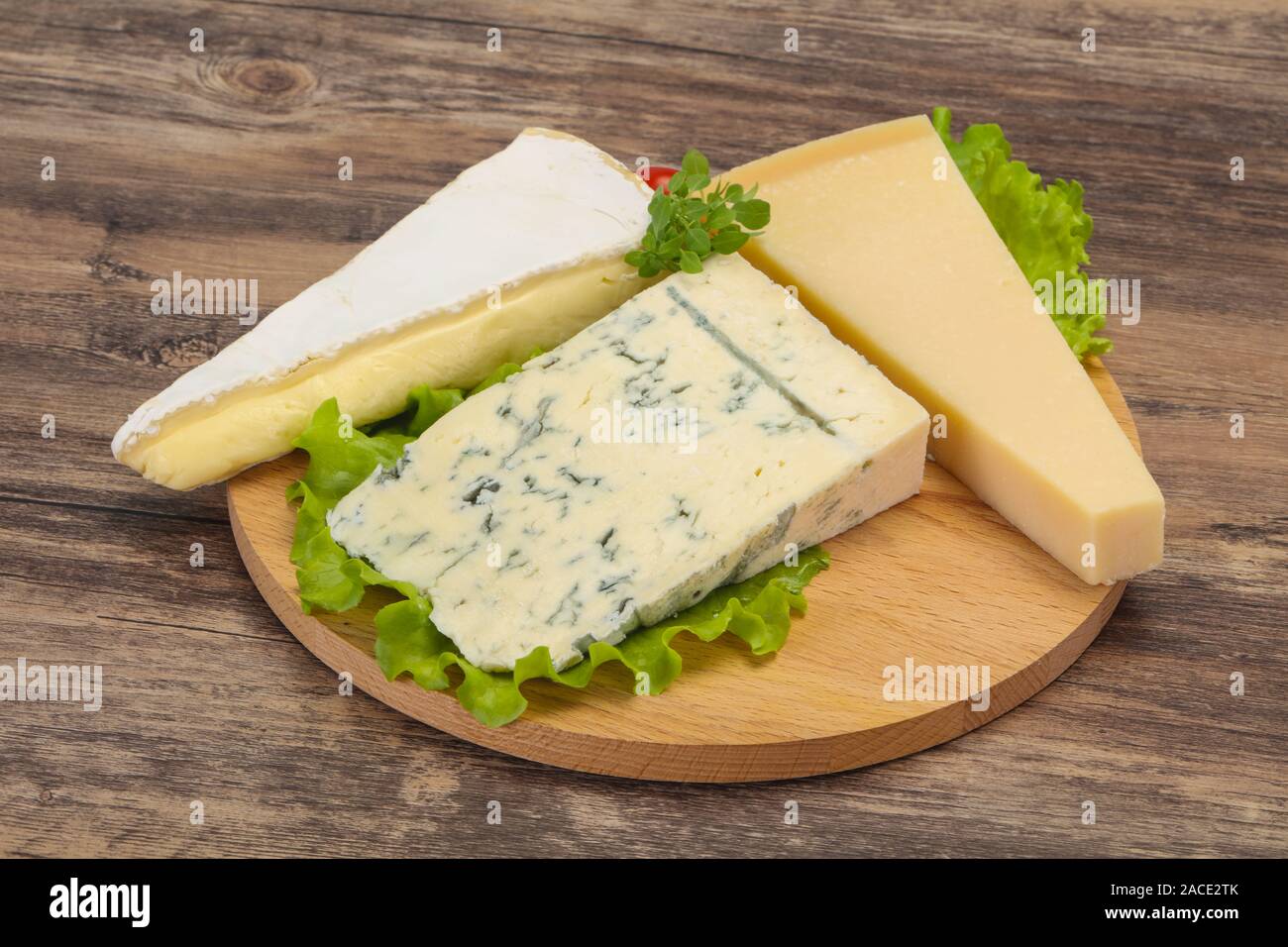 Cheese triangle mix brie and parmesan Stock Photo Alamy