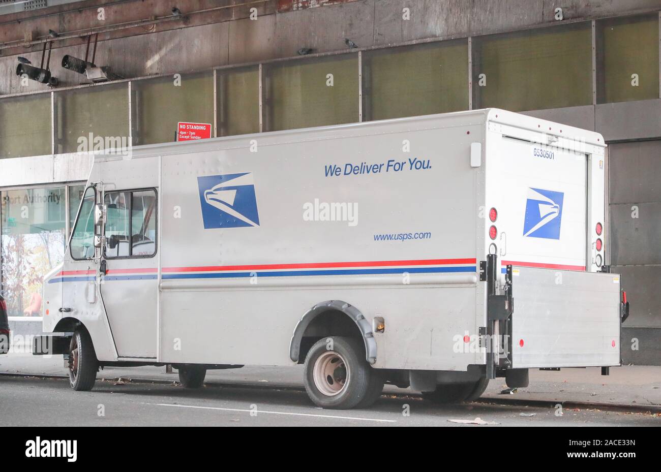 New York November 28 2019: USPS Post Office Mail Trucks in New York. The Post Office is Responsible for Providing Mail Delivery IV - Image Stock Photo