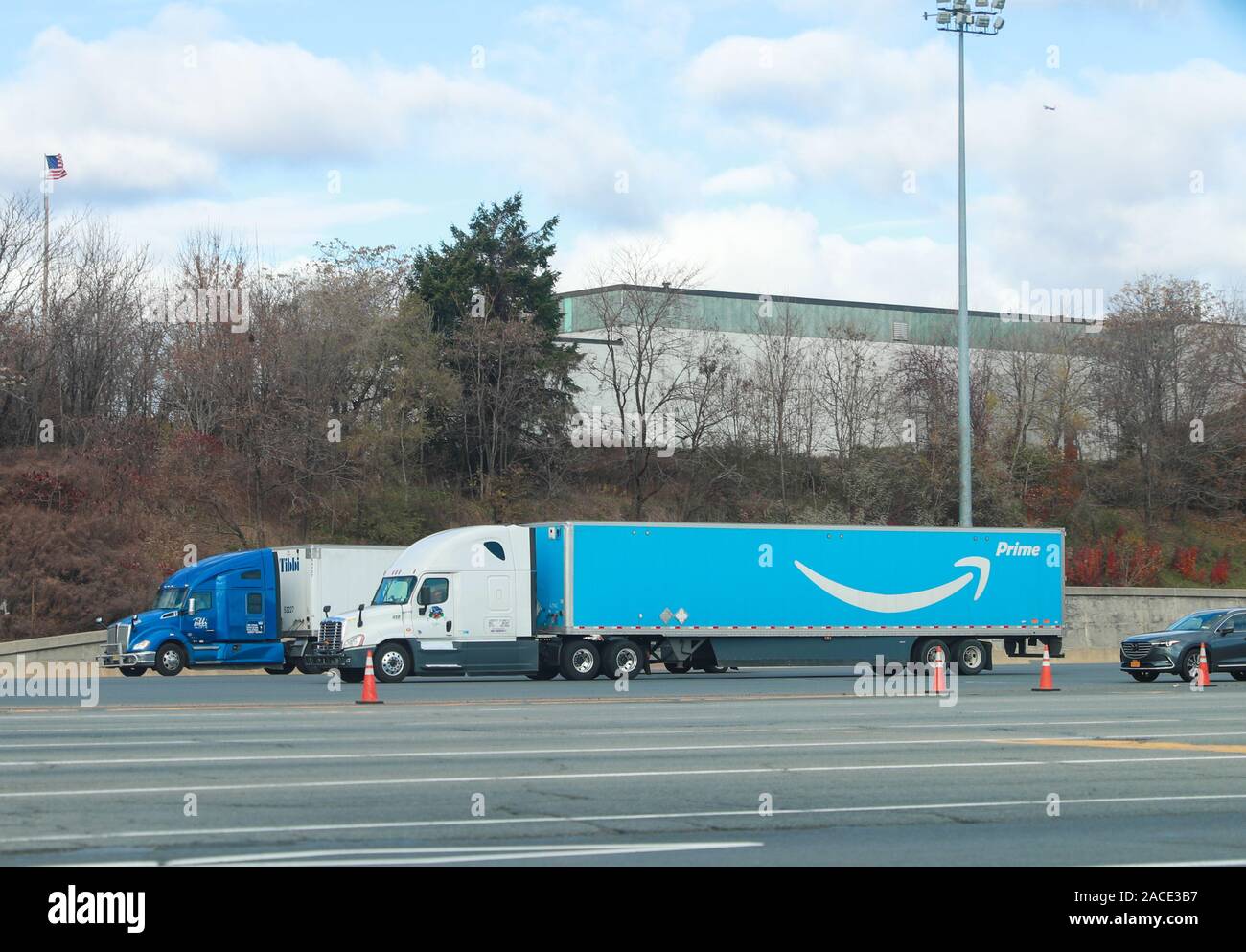 New York November 28 2019: Amazon truck driving on the interstate, the large Prime logo printed on the side - Image Stock Photo