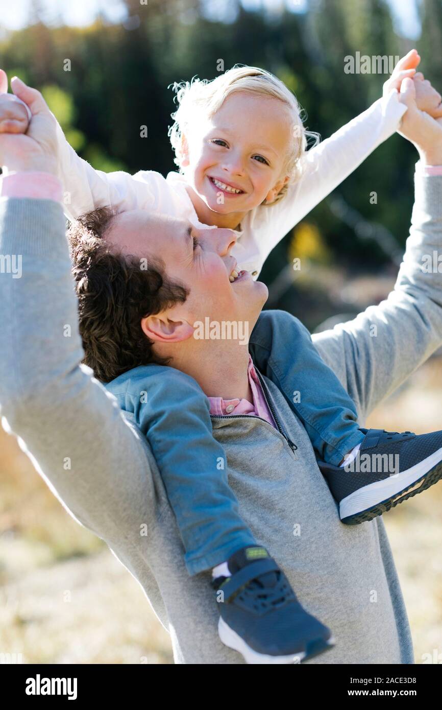 Two boys sitting on grass hi-res stock photography and images - Alamy