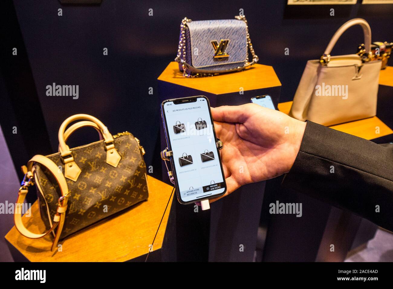 PARIS, FRANCE - NOV 16, 2018: Man installing Louis Vuitton City Guide app  on the latest iPad pro with Apple pencil after unboxing and setting-up the  new device Stock Photo - Alamy