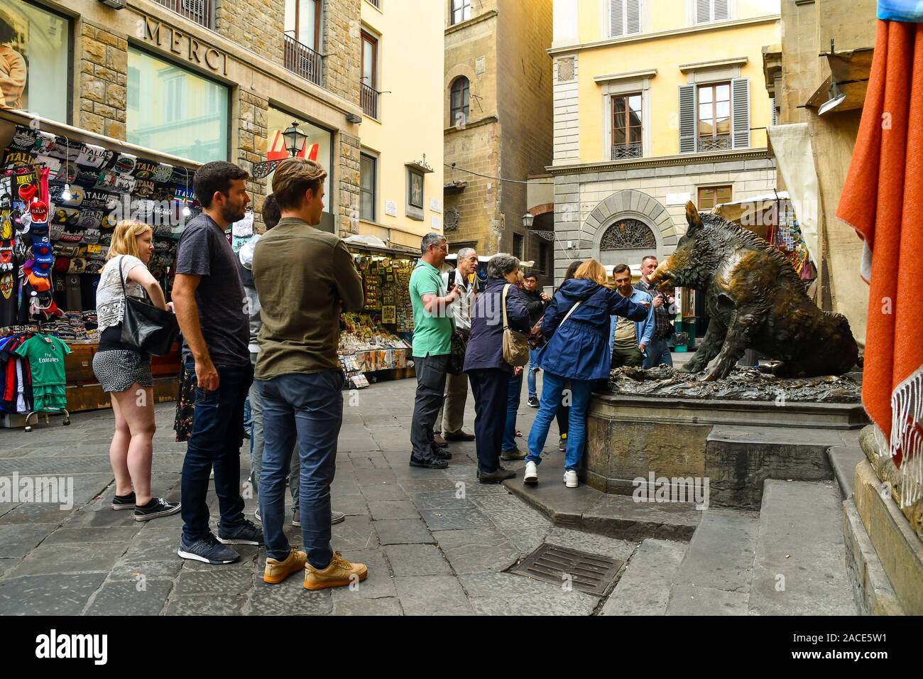 Group of tourists admiring the famous Fontana del Porcellino in the historic centre of Florence, Unesco World Heritage Site, Tuscany, Italy Stock Photo