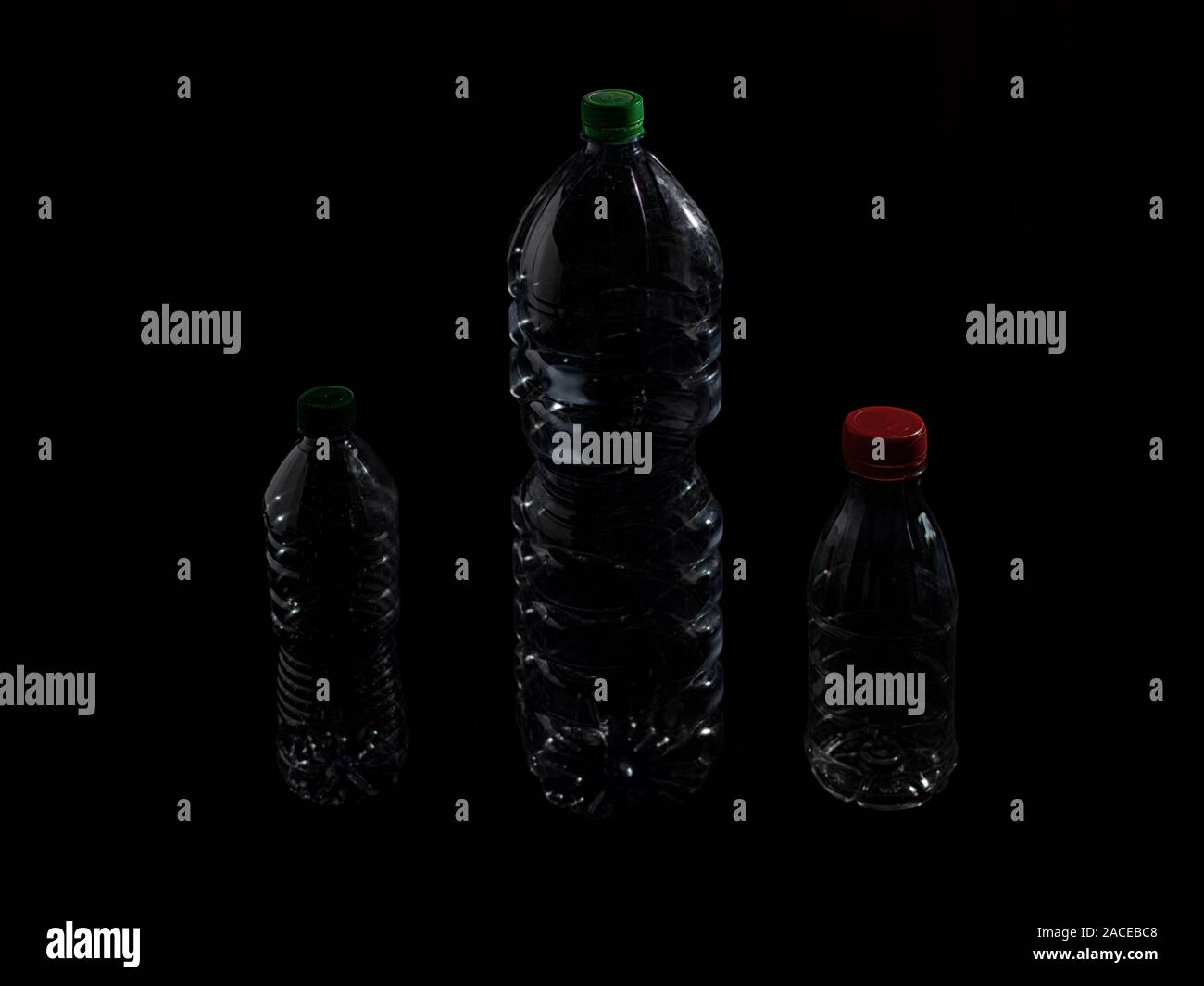 Plastic bottle in transparent PET on a dark background Stock Photo