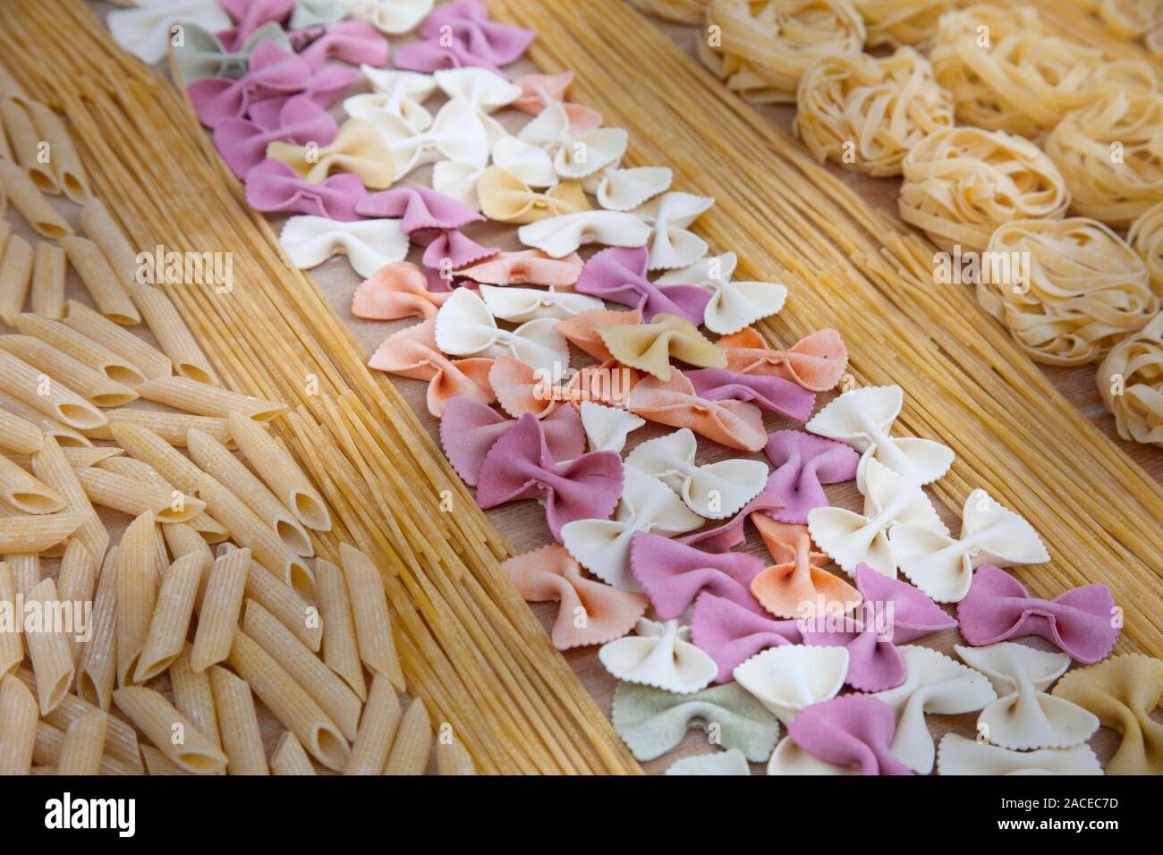 Assorted uncooked pasta in rows Stock Photo