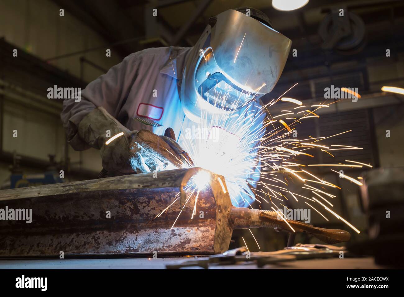Man welding with sparks flying Stock Photo