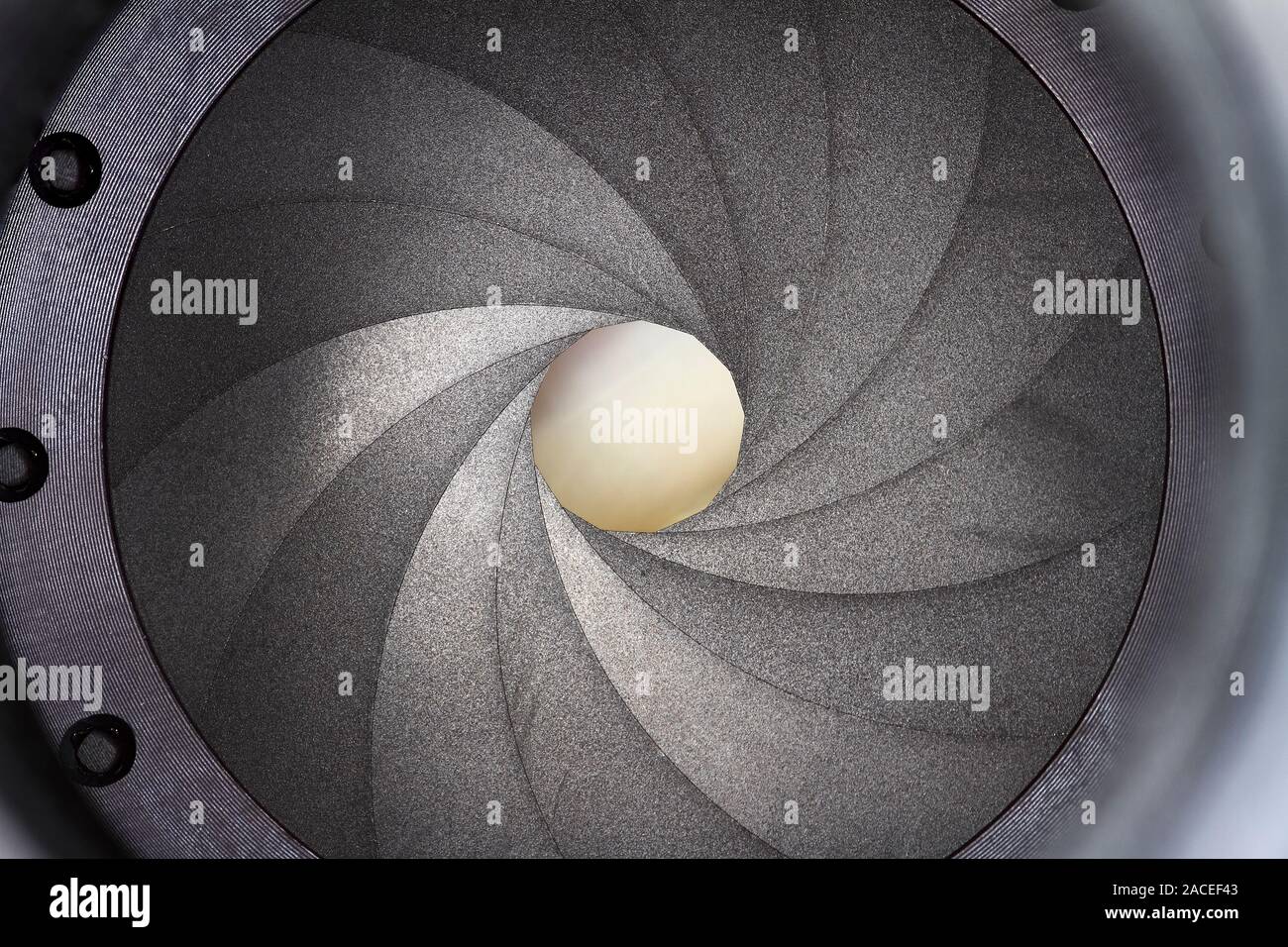 Macro view of the inside of a camera lens showing the aperture
