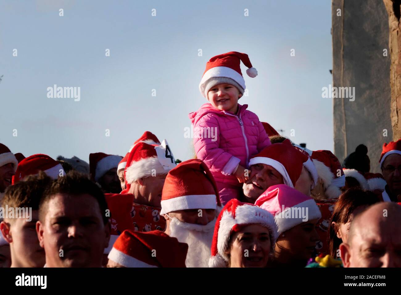 Around 500 people took part in the Monmouth Santa Fun Run, starting and finishing at the landmark, historic Monnow Bridge on Sunday 1st December. The Stock Photo